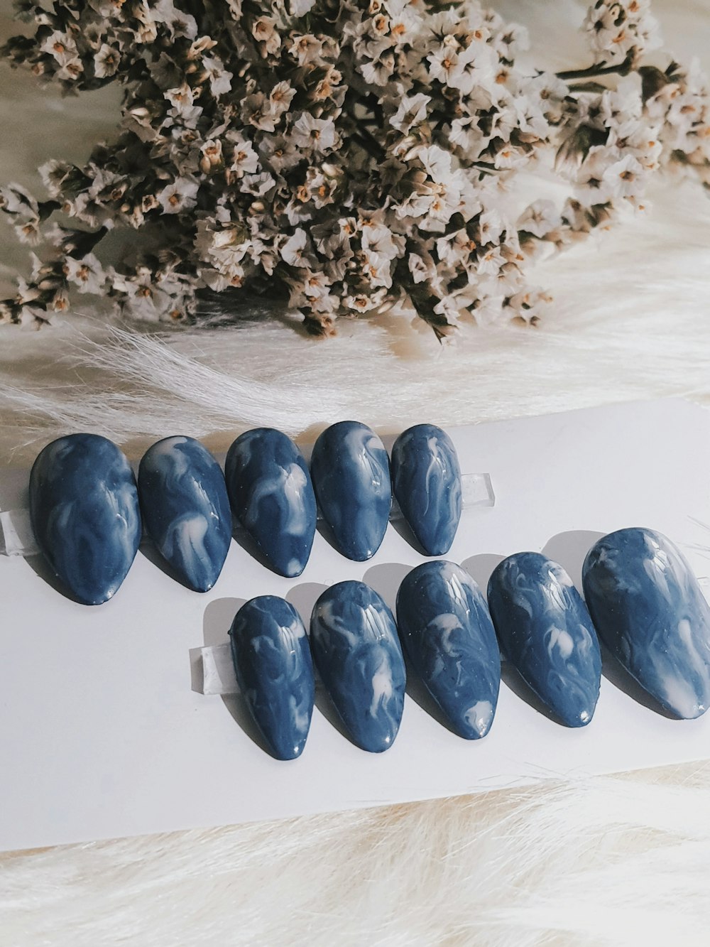 a bunch of blue rocks sitting on top of a table
