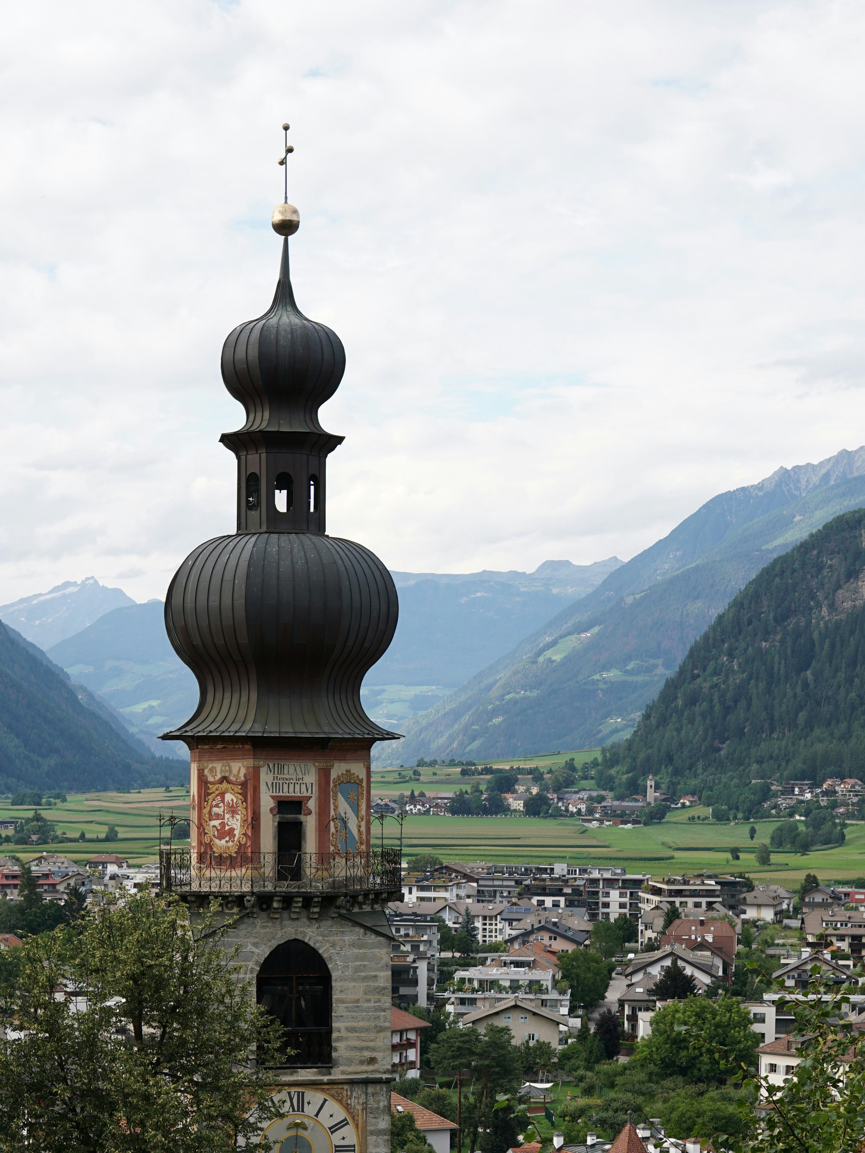 a tall tower with a clock on top of it