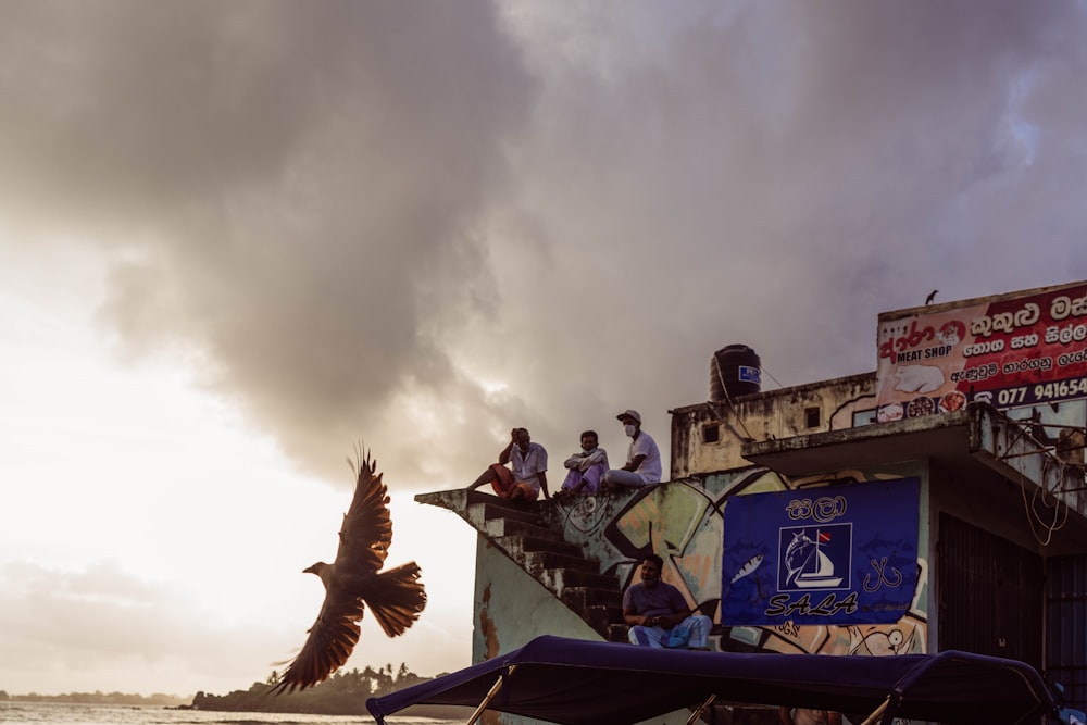 a group of people sitting on top of a boat