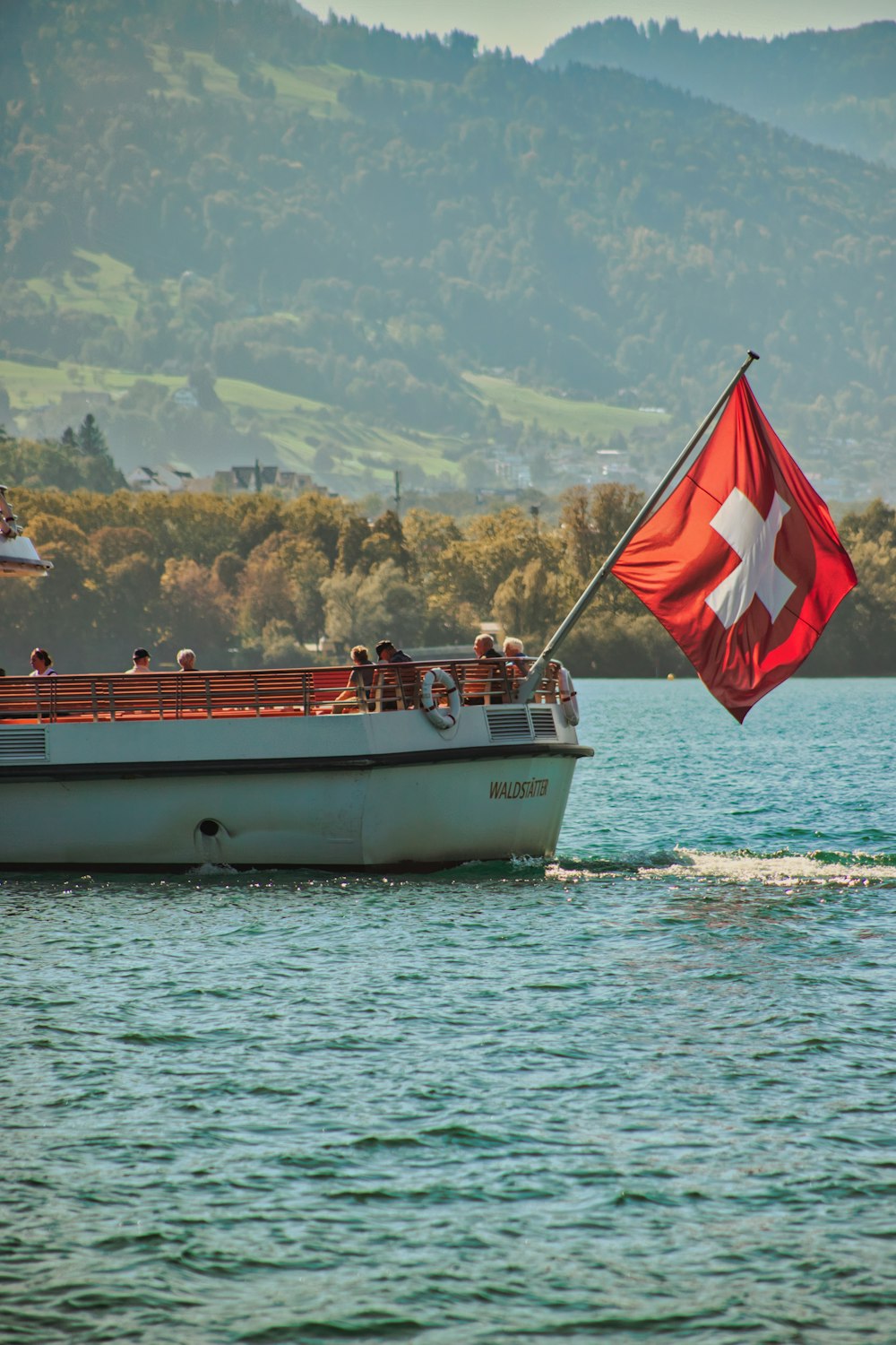 a boat with people on it in the water