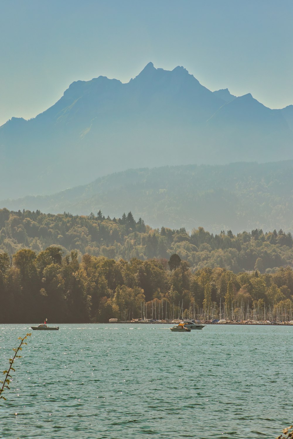 a large body of water with boats floating on top of it