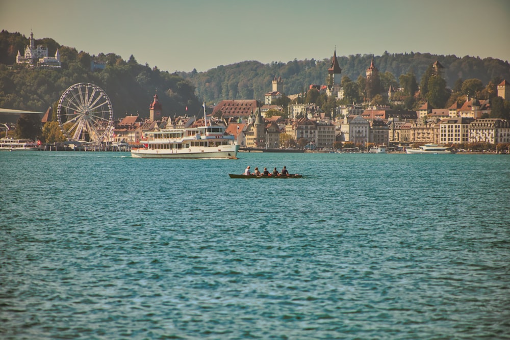 a group of people on a boat in the water