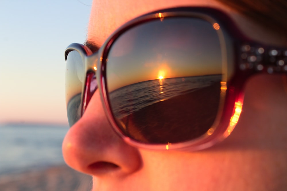 a close up of a person wearing sunglasses