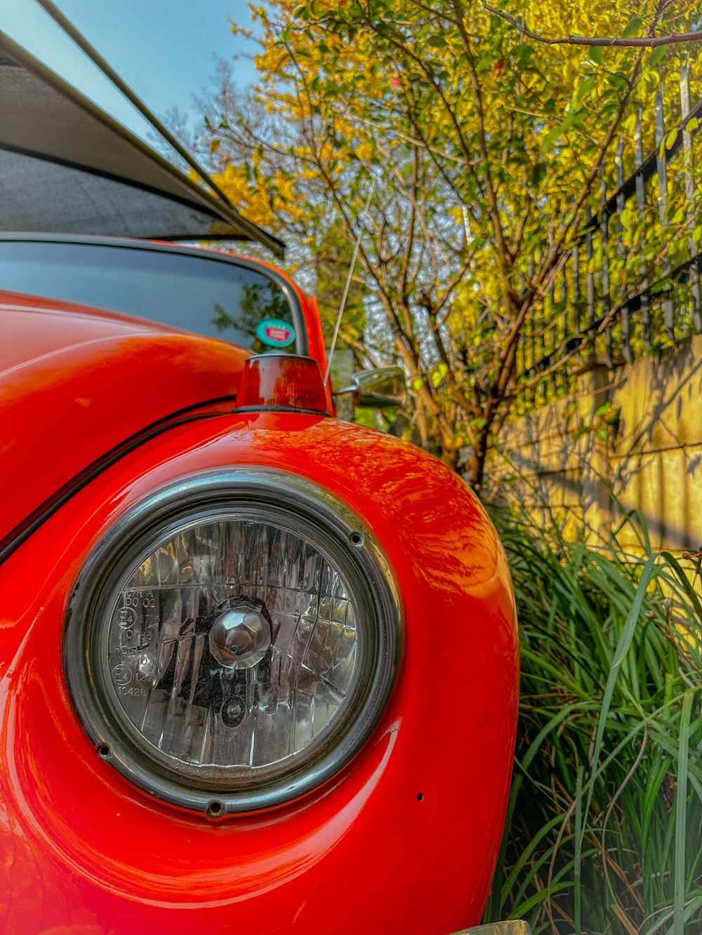 a close up of the front of a red car