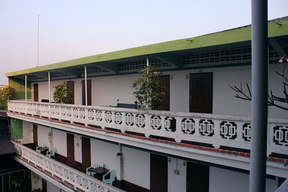 the balcony of a building with a green roof