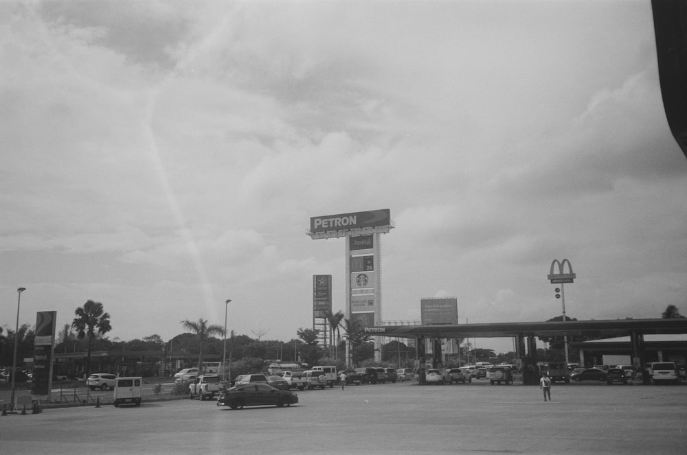 a black and white photo of a gas station