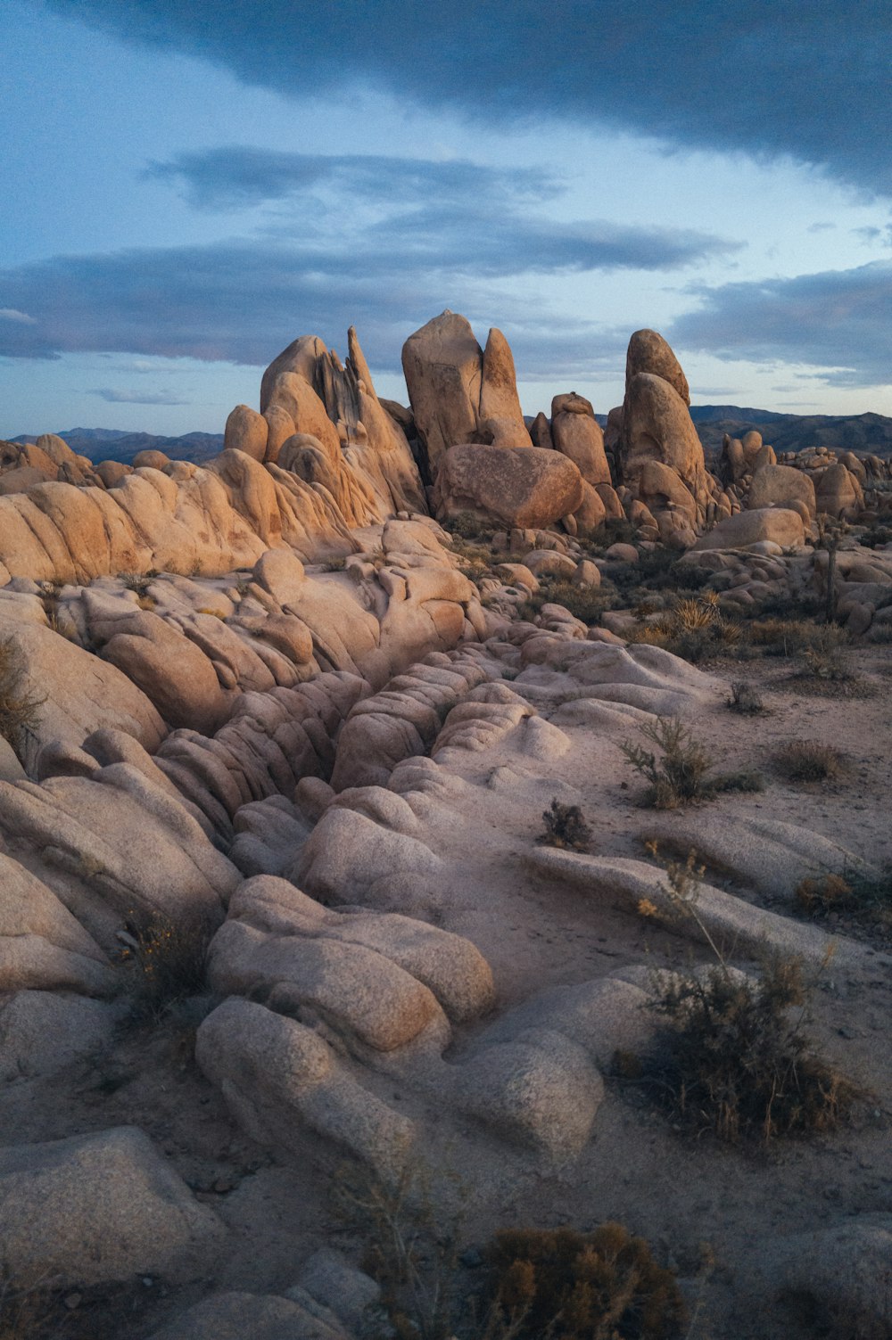 a large rock formation in the middle of a desert