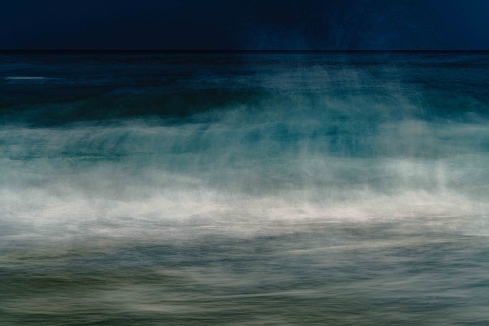 a large body of water with waves coming in