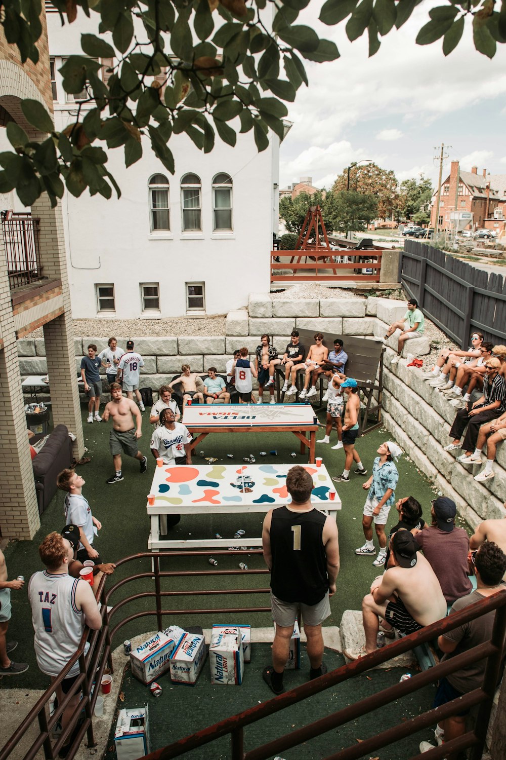 a group of people playing a game of ping pong