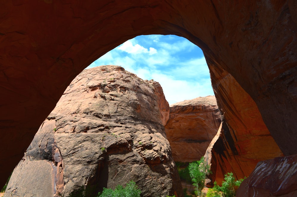 a large rock formation with a sky background