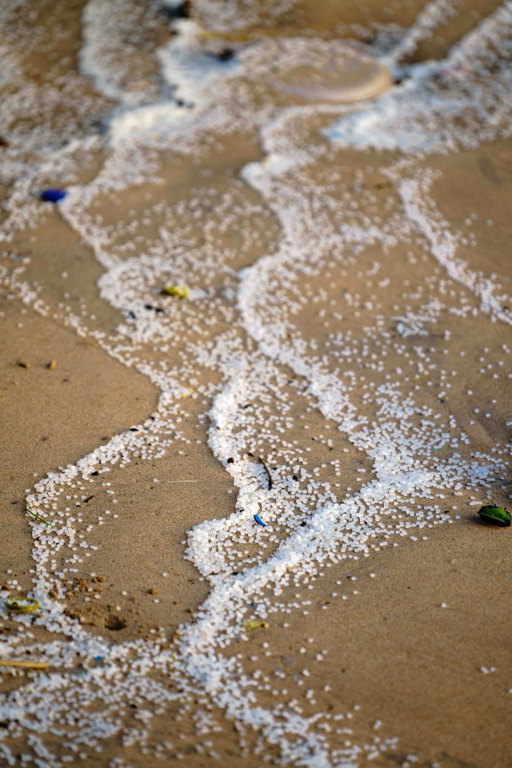a close up of a beach with white sand