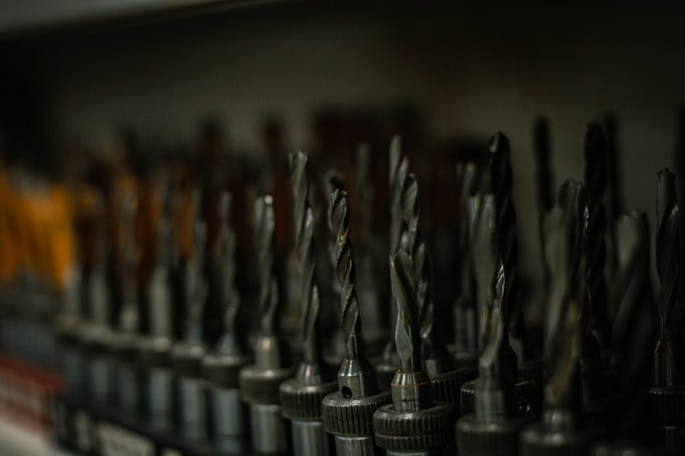 a bunch of drill heads lined up in a row