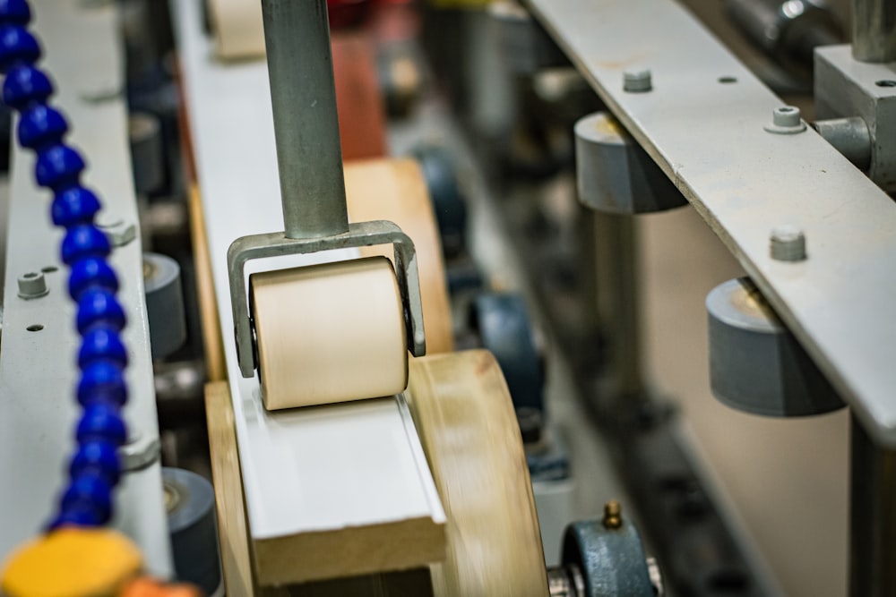 a close up of a machine with a roll of tape