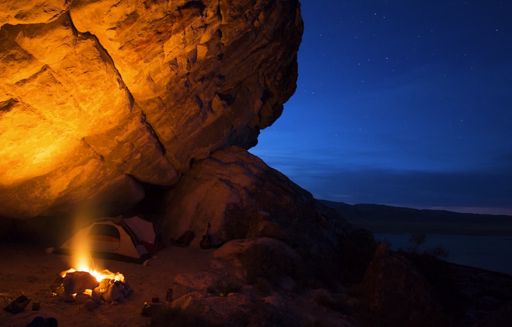 a campfire in the middle of a desert at night