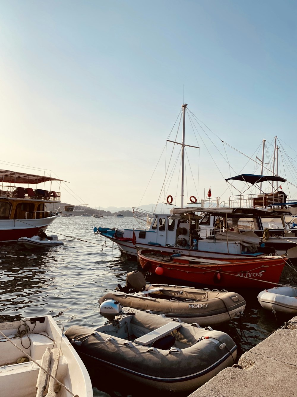 a number of small boats in a body of water