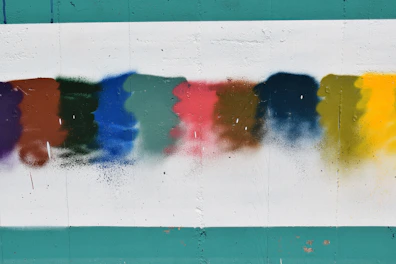 a group of different colors of paint on a wall