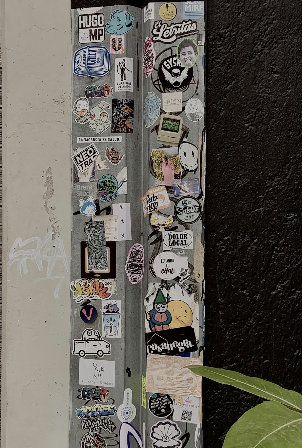 a bunch of stickers are attached to a door