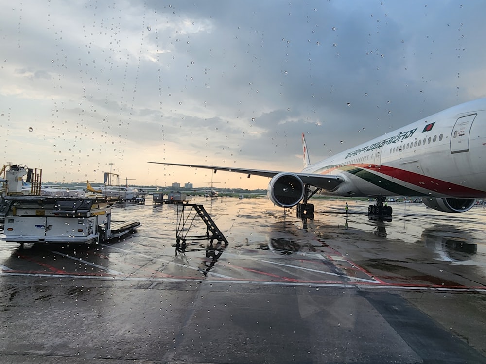 a large jetliner sitting on top of an airport tarmac