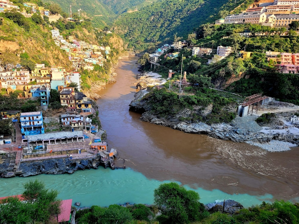 a river running through a lush green hillside