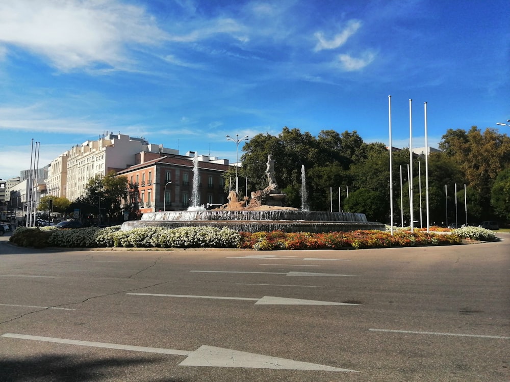 a large building with a fountain in the middle of it