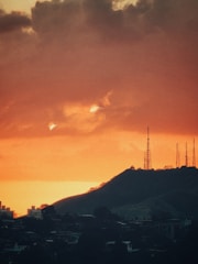 A high-contrast image of data streams overlaying a cityscape with cell towers.