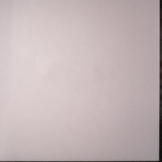 Close-up of the infinite cyclorama wall with smooth curves and bright white surface