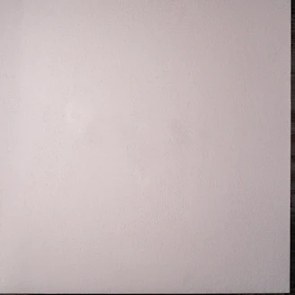 Close-up of the infinite cyclorama wall with smooth curves and bright white surface