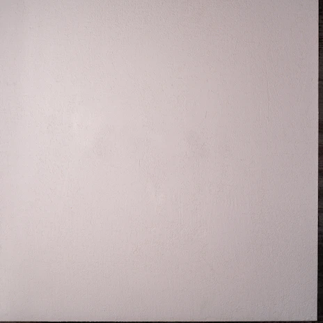 Modern ciclorama wall with seamless white curve, perfect for video shoots.
