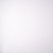 A plain white textured wall with a subtle stucco pattern. The wall shows swirled designs that create a slightly bumpy and irregular surface.