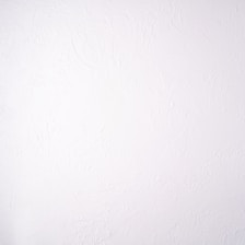 Interior room showcasing a freshly applied decorative wall coating with a smooth finish.