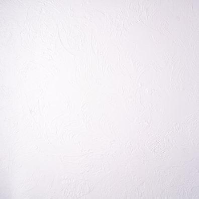 Smooth plastered walls with elegant wall finishes in a cozy interior.