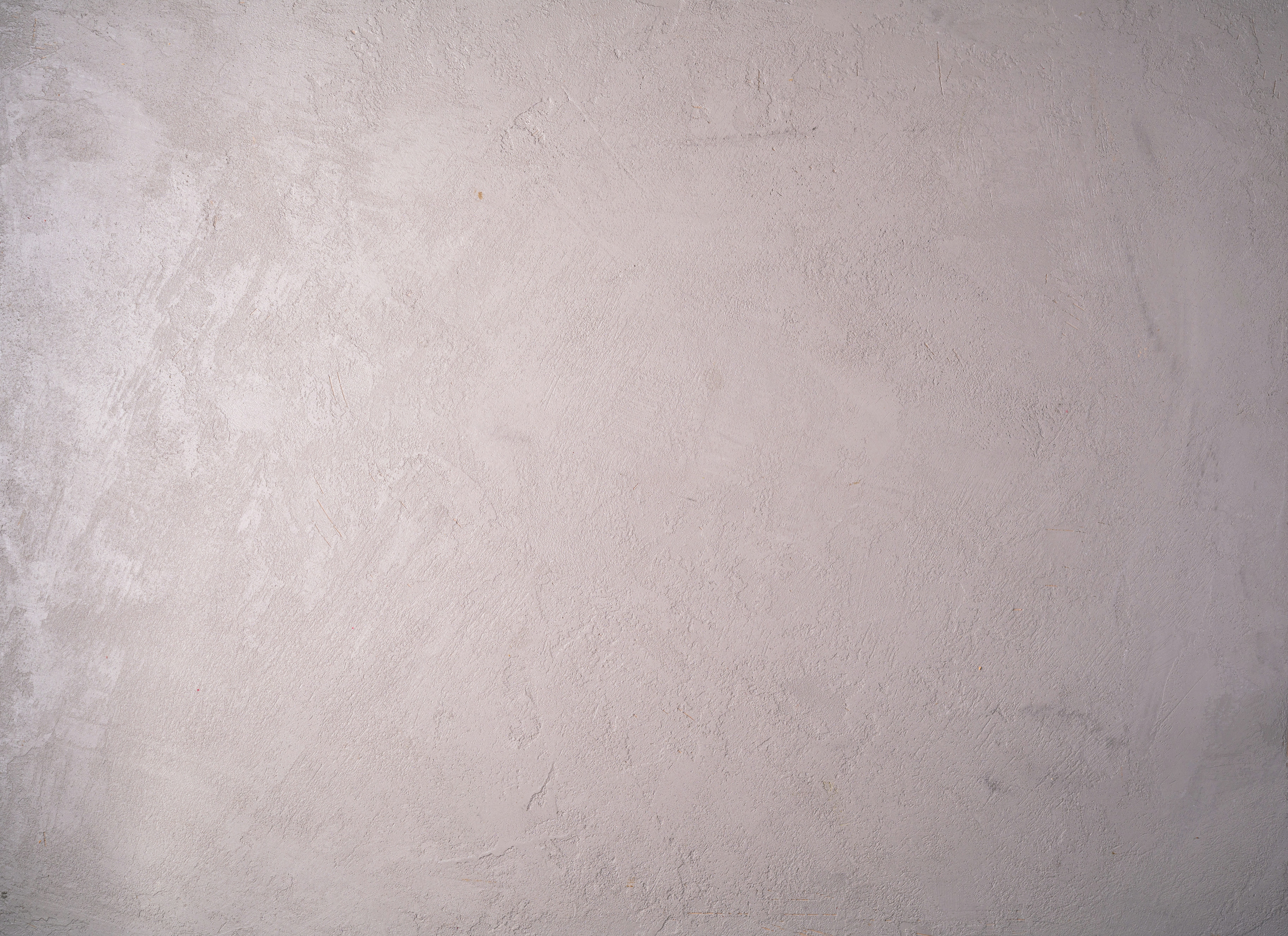 a black and white photo of a white wall