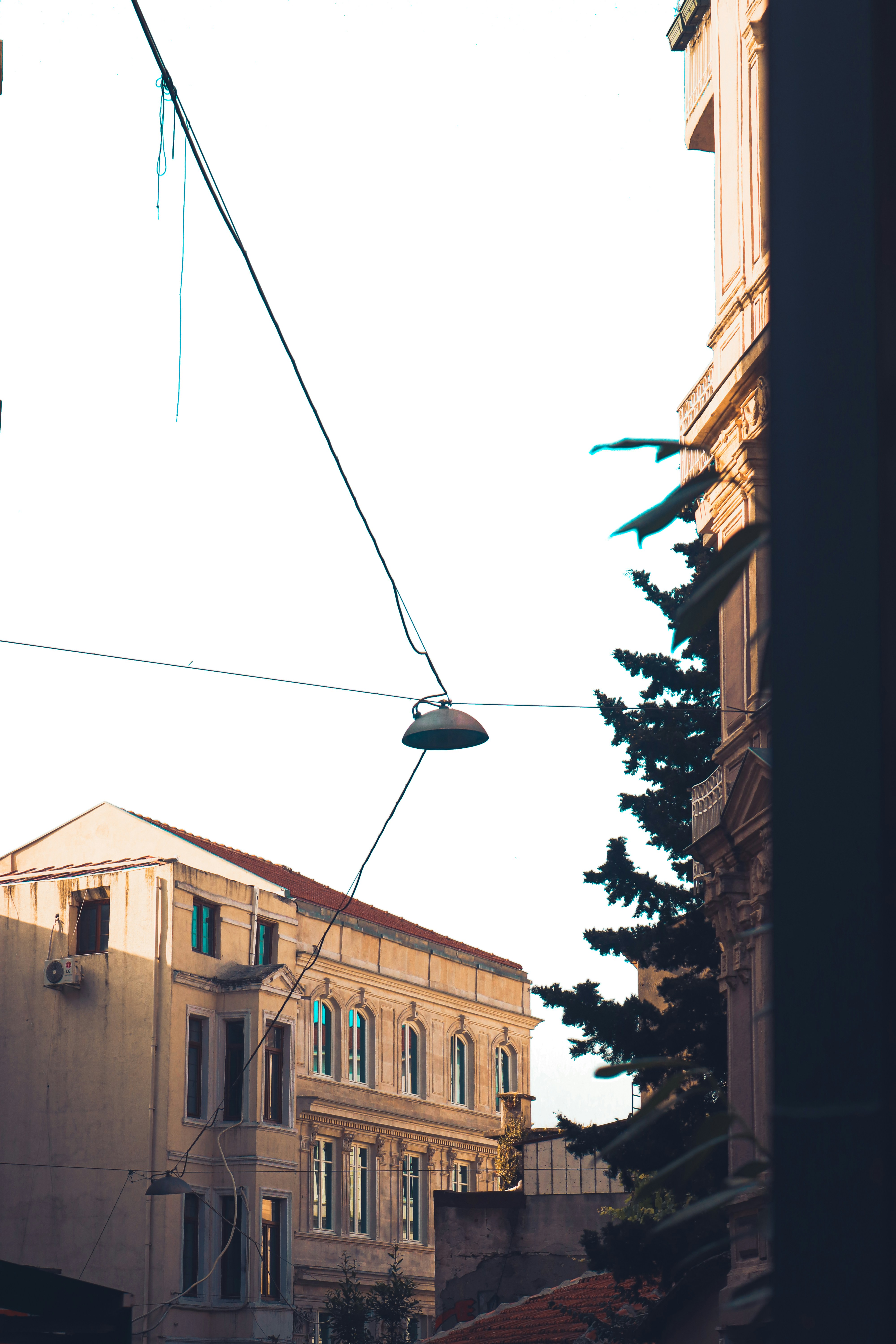 a street light hanging over a city street