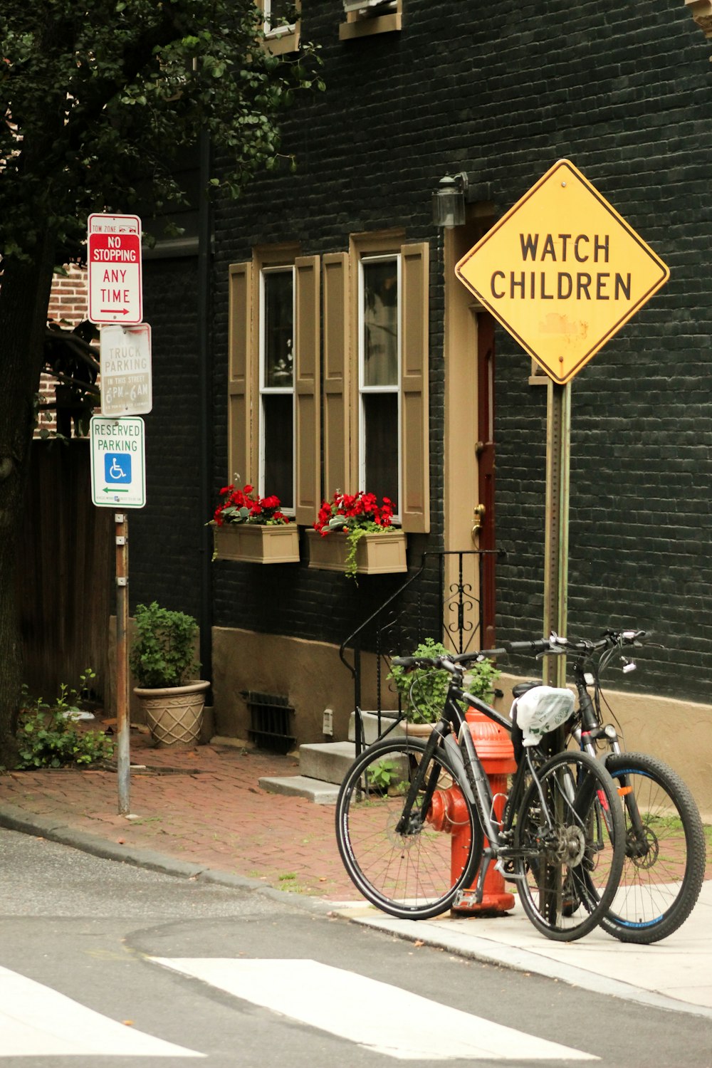 a bicycle parked next to a fire hydrant