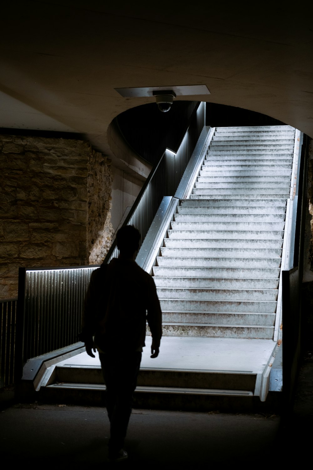 a person walking up a set of stairs