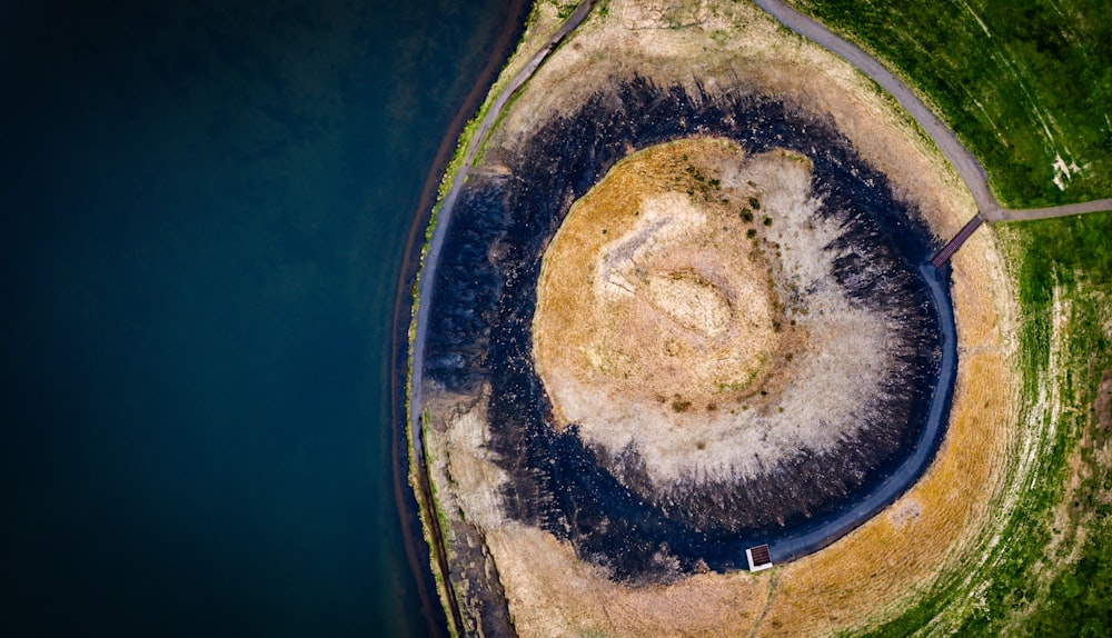 an aerial view of a circular rock formation