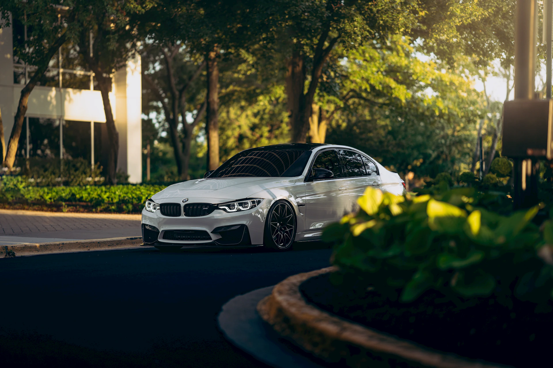 a white car parked on the side of the road