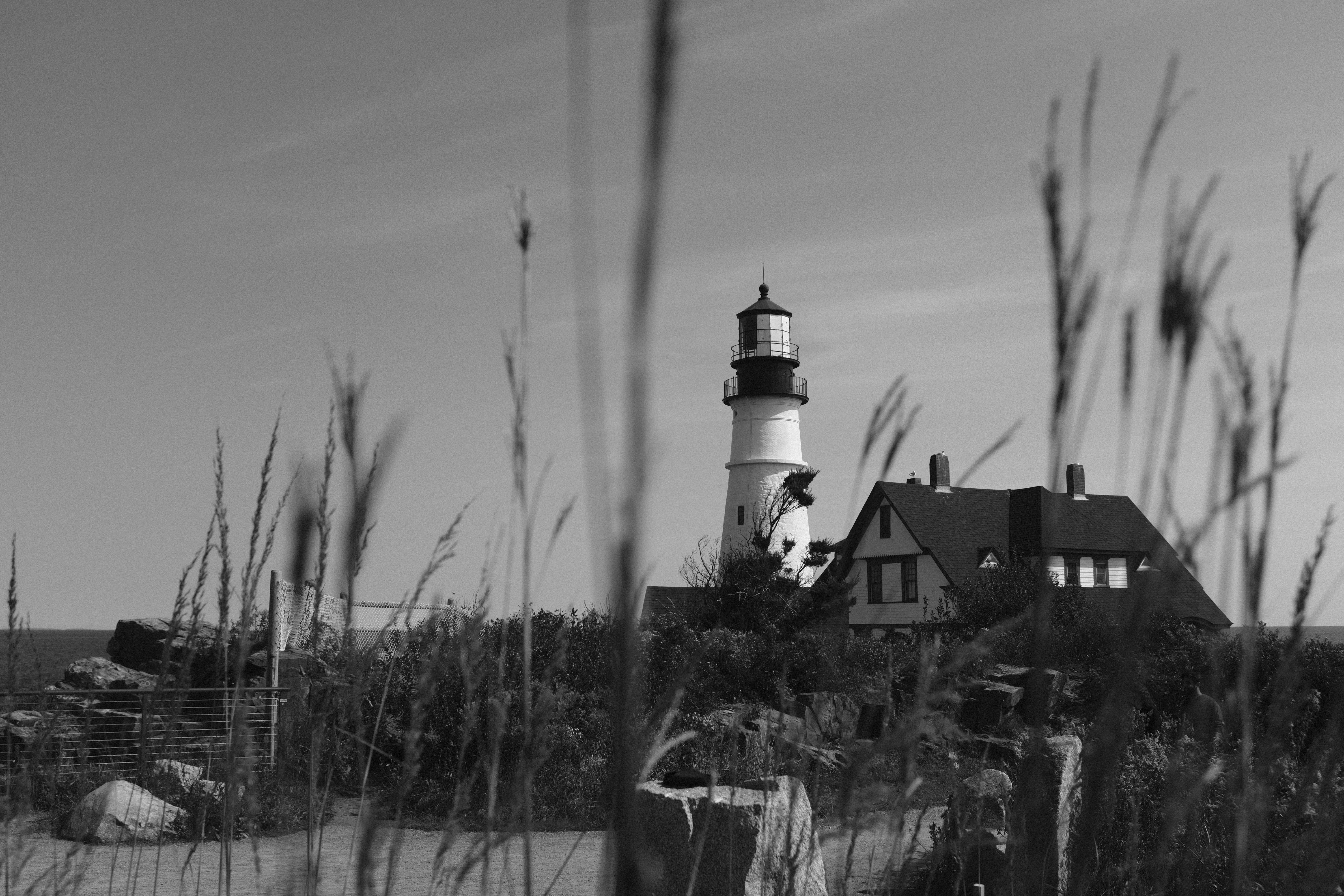 a black and white photo of a lighthouse