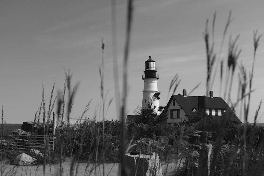 a black and white photo of a lighthouse