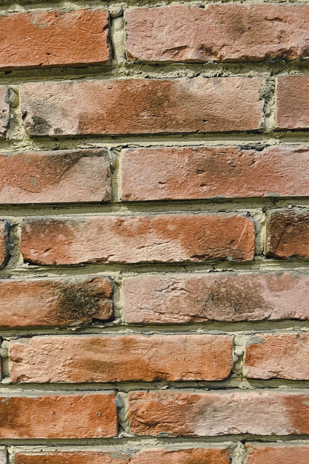 a close up of a red brick wall