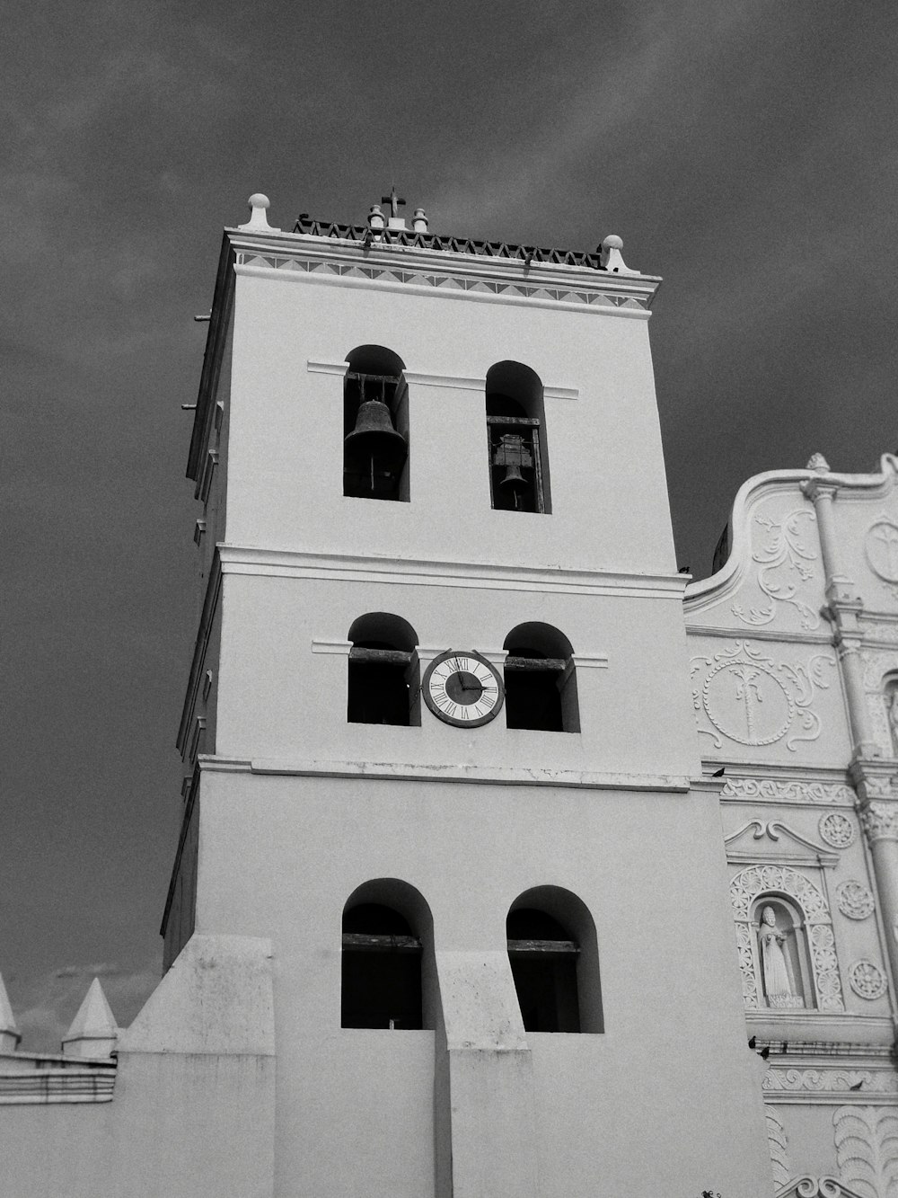 a black and white photo of a clock tower