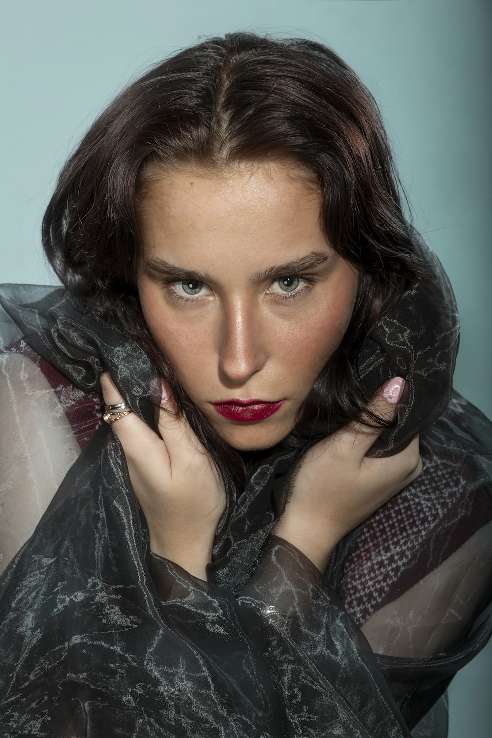 a woman in a black dress with a red lipstick