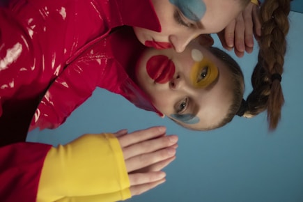two young girls with face paint on their faces