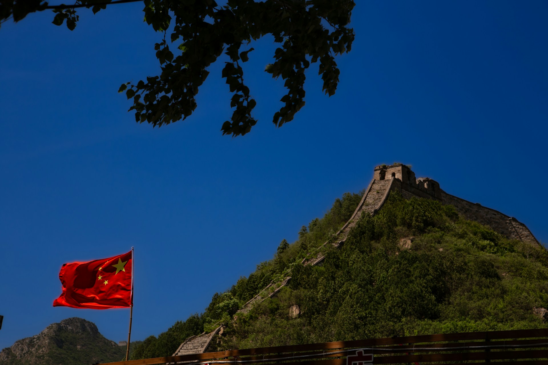 An impressive shot of the Great Wall of China blending with the lush greenery of Zambia’s Victoria Falls, symbolizing the connection between the two nations.