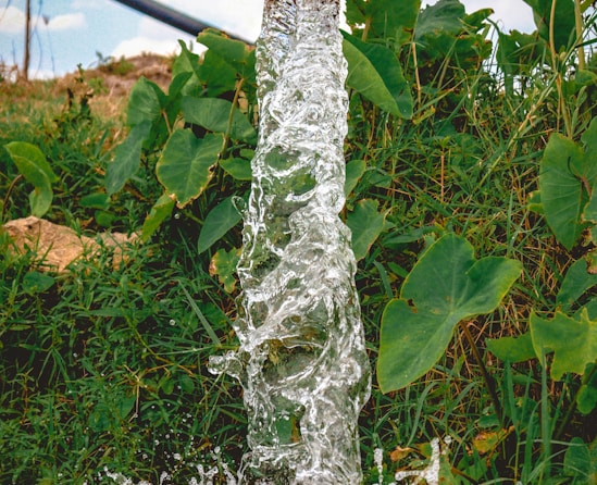 a pipe that has water coming out of it