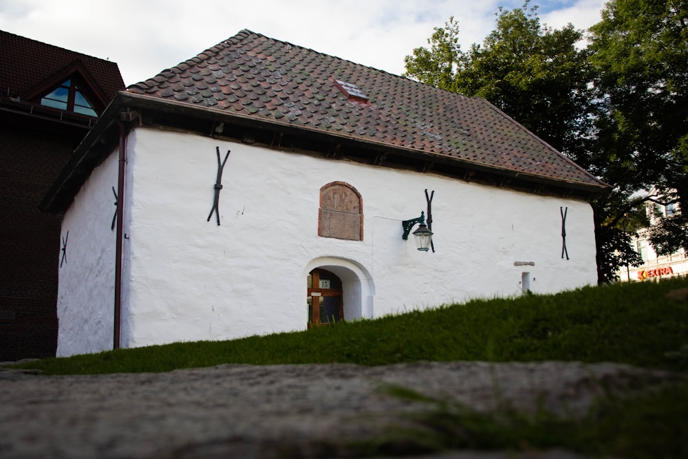 a white building with a clock on the side of it