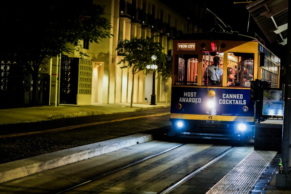 a trolley on a city street at night