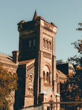 a tall tower with a clock on the top of it