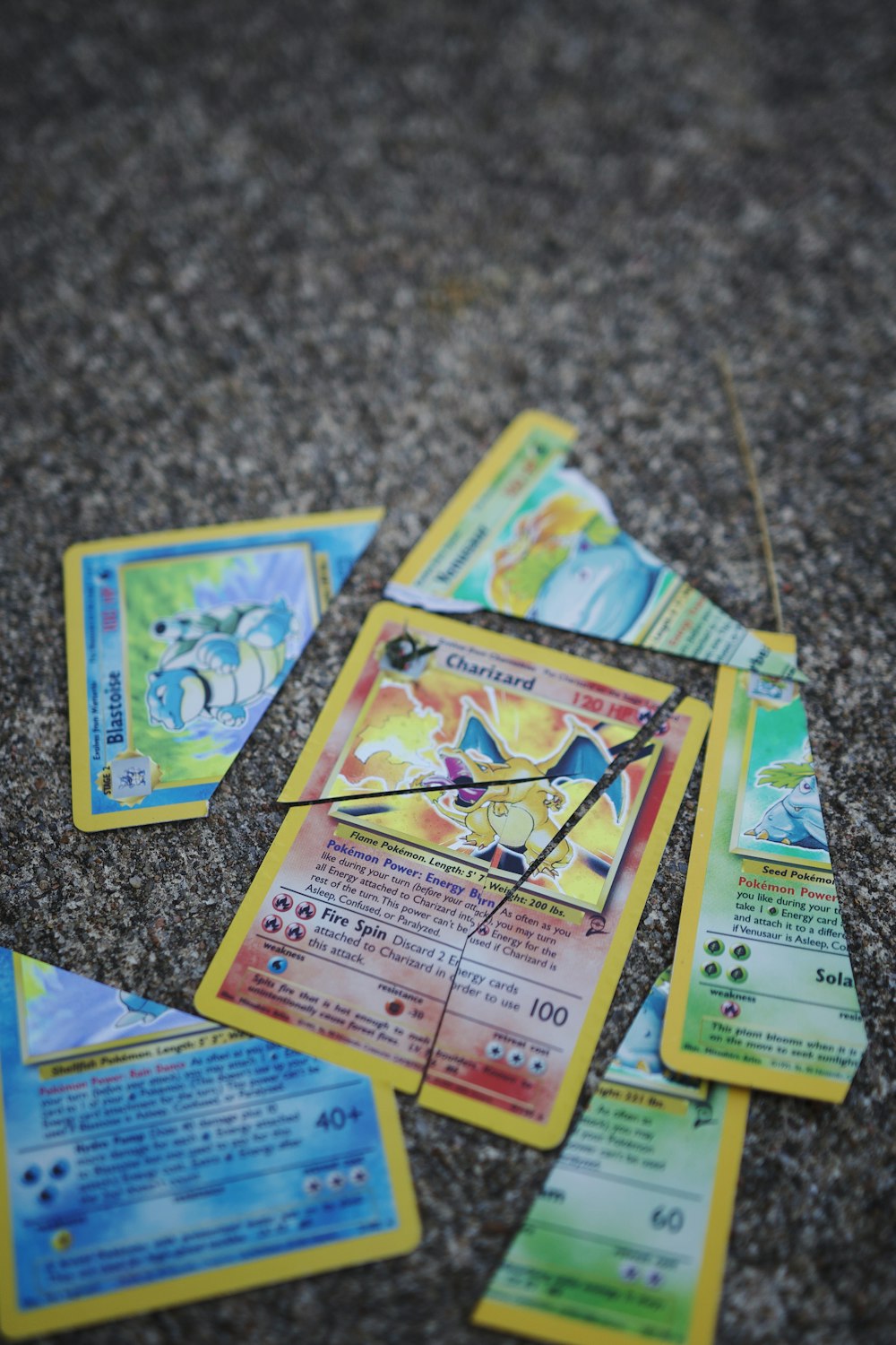 a bunch of pokemon cards laying on the ground