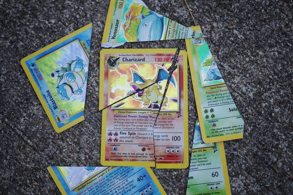 a bunch of pokemon cards laying on the ground